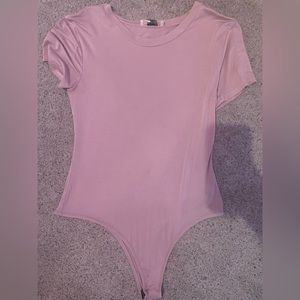 light pink body suit, only worn a few times. asking for 6 obo.